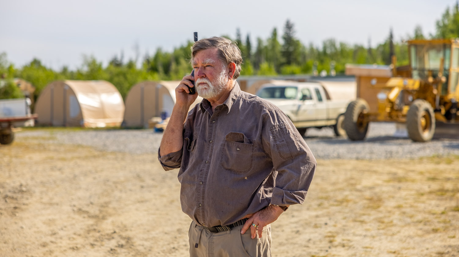 Kit Marrs using a telephone